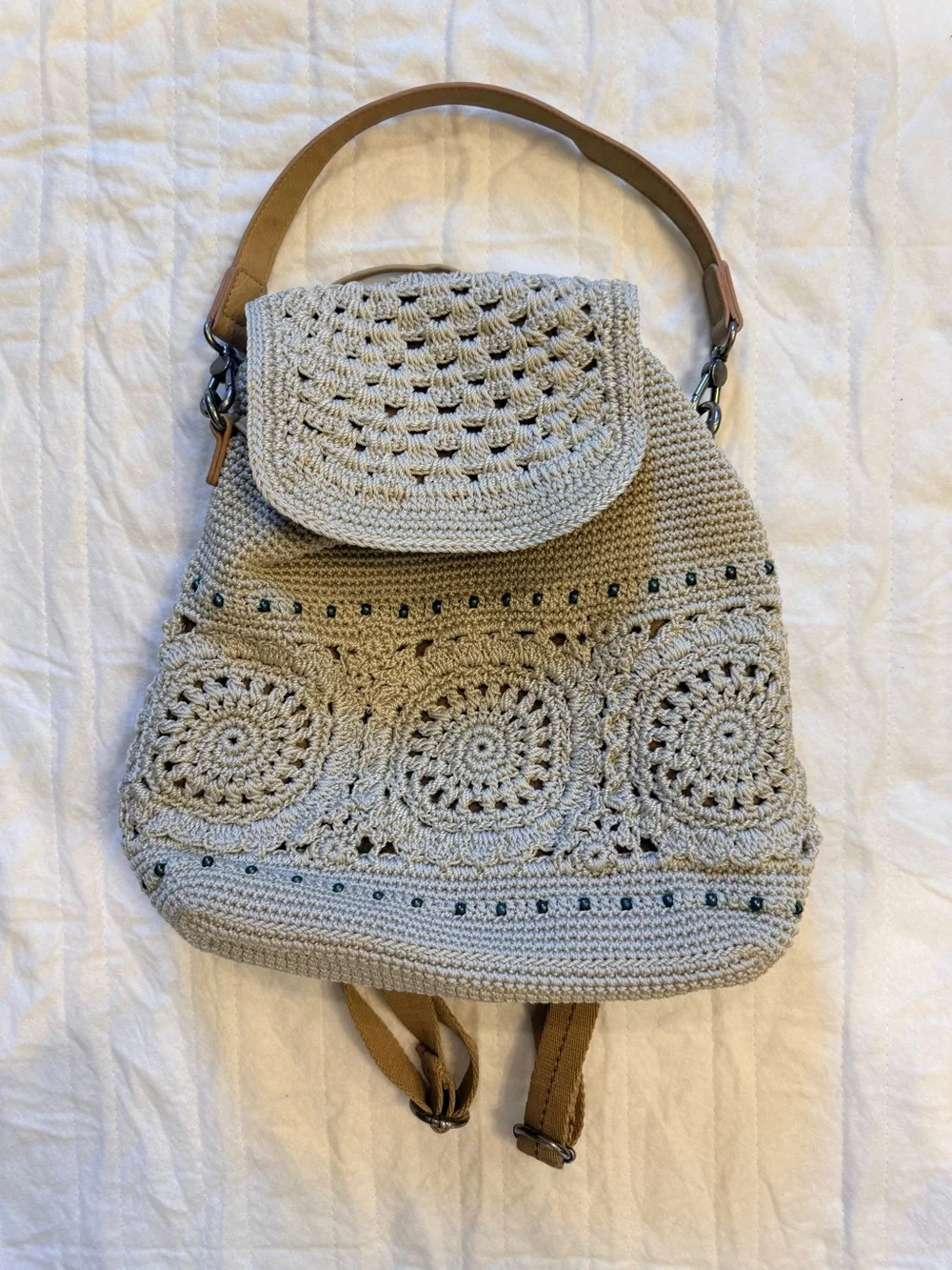 The Sak Crochet-Style Backpack in Light Beige with Tan Handle